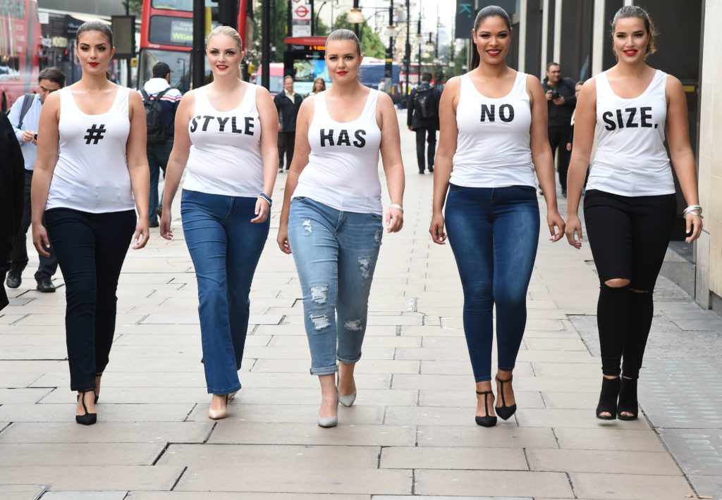 Women of many body types walking down the street