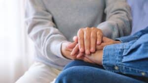 Hands offering comfort