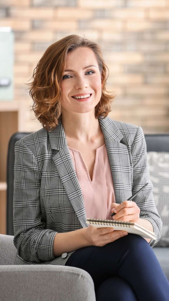 Body Dysmorphia Treatment at Eating Disorder Solutions Therapist Smiling With Notepad