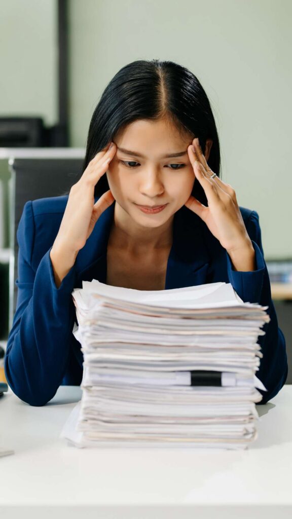 Infographic listing common workplace triggers for eating disorders including stress, perfectionism, and body image concerns