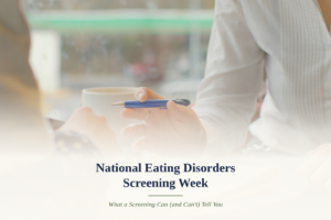 Close-up of two people at a table with a notebook and pen, symbolizing a supportive conversation during National Eating Disorders Screening Week